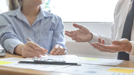 Business team meeting, Marketers and financial accountants are discussing and analyzing charts to plan strategies to meet customer needs, Brainstorming and business discussions.の写真素材
