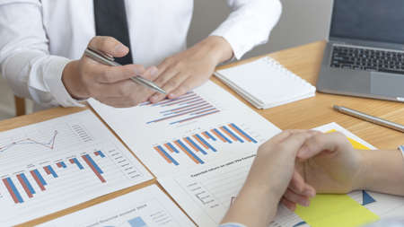 Businessman is negotiating on investment to expand the market and suggest ways to increase income for young investors, Business Chat and Marketing Team Meetings.の写真素材