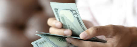 Businessmen are counting dollar amounts and paying bonuses to accountants, Giving a salary or bonus...