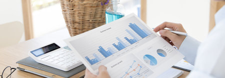 Accounting businessmen are calculating income-expenditure and analyzing real estate investment data,...