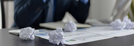 Business men are stressed due to erroneous work and poor sales, Mistakes and Despair concept.の写真素材