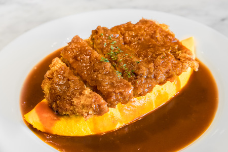 Demiglace sauce omurice with pork cutlet or tonkatsu. Omelette rice,omurice, Japanese foodの写真素材
