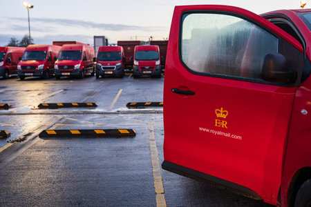 SWANSEA, WALES, UK - DECEMBER 12, 2020: Red Royal mail vans with logo and website on open door in...
