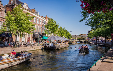 Boats with tourists on canal in Leiden, the Netherlandsのeditorial素材