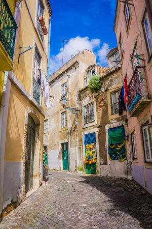 LISBON, PORTUGAL - MARCH 25, 2017: Narrow old streets with vintage balconies of Alfama district, Lisbon, Portugalのeditorial素材