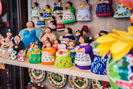 Traditional souvenirs of Otranto, Apulia, Italy. Colorful ceramic figures of women. Gifts from Pugliaの写真素材