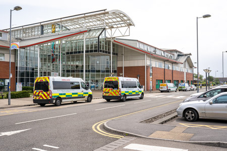 Port Talbot, UK - July 4, 2021: Neath Port Talbot Hospital, south Wales, UK. It is managed by Swansea Bay University Health Board. Ambulances parked outside hospitalのeditorial素材