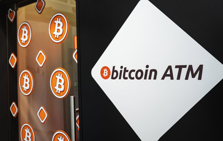 Bitcoin ATM entrance sign for BTC cryptocurrency exchange machine that allows to buy and sell Bitcoin crypto.の写真素材