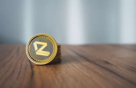 Zilliqa coin with stack of crypto coins on wooden surface with copy space. Close-up of ZIL cryptocurrency token.の写真素材