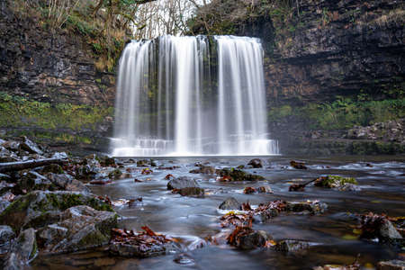 Sgwd yr Eira waterfall or fall of snow along the Four Waterfalls walk, Waterfall Country, Brecon Beacons national park, South Wales, the United Kingdomの写真素材
