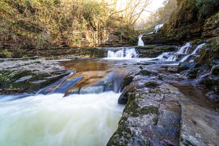 Sgwd Isaf Clun-Gwyn waterfall along the Four Waterfalls walk, Waterfall Country, Brecon Beacons national park, South Wales, the United Kingdomの写真素材