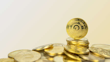 Polkadot or Dot cryptocurrency standing on pile of gold crypto coins with copy space.の写真素材