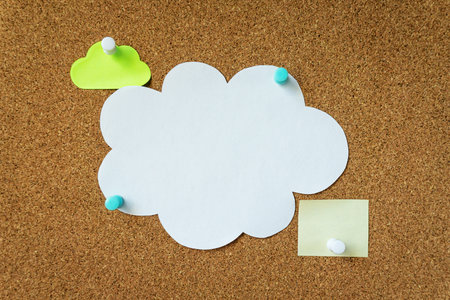 Stickers pinned to a cork boardの写真素材