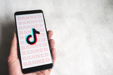 Tiktok logo with Banned signs on phone screenのeditorial素材