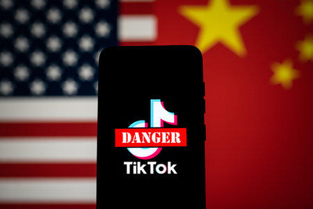 Tiktok logo with danger sign and US and China flagのeditorial素材