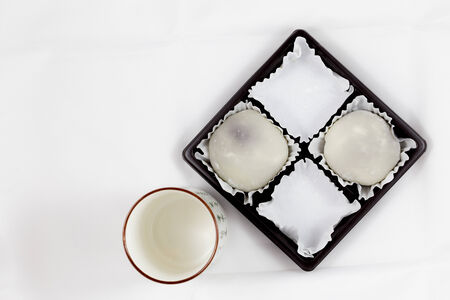 Half Pack of White Mochi and Japanese Tea Cupの写真素材