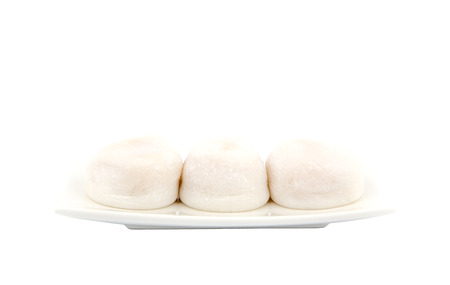 Three White Mochi on White Plateの写真素材