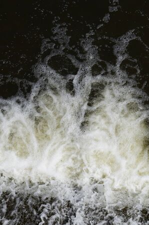 Jets of falling water on the dam.
