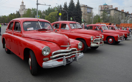 Red cars of the Moscow automobile plant "Pobeda". Filmed on May 9, 2019 during the Victory Parade and the Immortal Regiment action.のeditorial素材