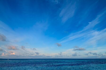 Tropical morning seascape of the fresh blue sea water, blue sky and clouds in Maldives.の写真素材