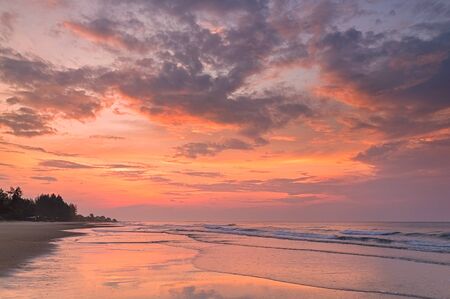 Stunning sunrise over the sea at the beach in Rayong province, Thailand.
