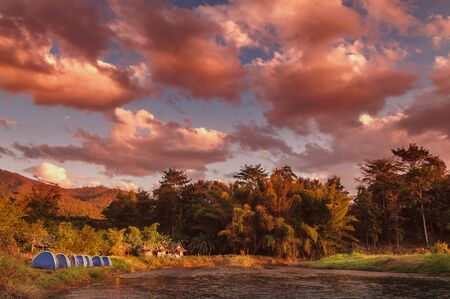Dramatic golden hour at the river-side camping area in Pai, Mae Hong Son province, the northern part of Thailand.の写真素材
