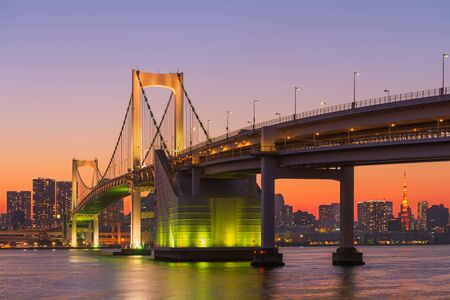 Beautiful twilight scene of Tokyo Bay, Rainbow Bridge and Tokyo Tower at Odaiba, Tokyo, Japan.の写真素材