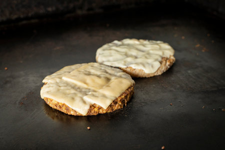 Hamburgers with cheese on a black background. tinting. selective focus