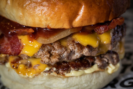 Close up of a cheeseburger with bacon and mayonnaiseの写真素材