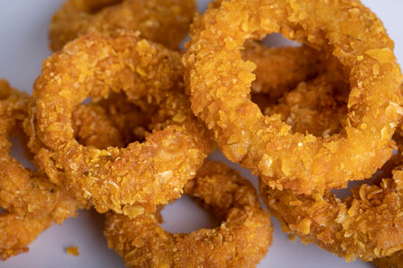 Fried onion rings on a white background. Selective focus.の写真素材