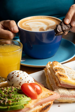 Breakfast with coffee, croissant, sandwiches and orange juiceの写真素材