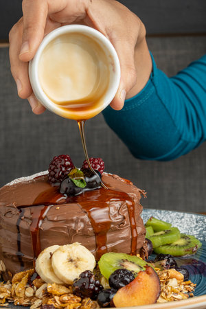 Chocolate cake with a cup of coffee on a wooden background.の写真素材