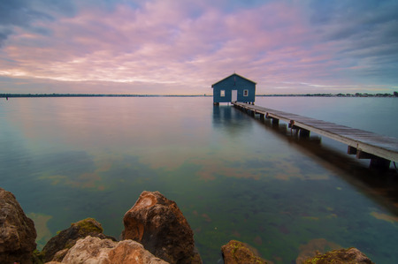 Western Australia - Sunrise View of Perth Skyline from Swan River with boatshed as a foregroundの写真素材