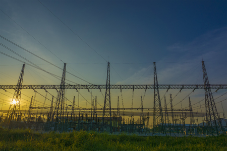 The evening electricity pylon silhouette. Clean energy concept.