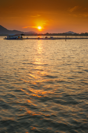 Sunset Over The Sea. Vibrant Colors. A Bit Soft Focus due to Slow Shutter Speed.の写真素材