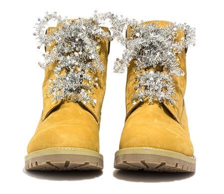 Hiking boots with laces Christmas, Isolated on white background の写真素材