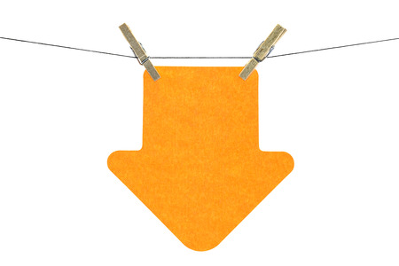 Flat orange arrow sticky note hanged, isolated on white backgroundの写真素材