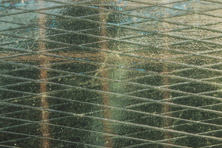 texture of a glass window in a house with bars on the window