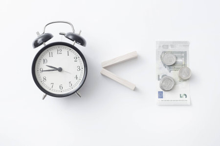 Funny business concept money, old vintage alarm clockの写真素材