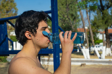 man doing pull ups in park outdoor, exercise,の写真素材