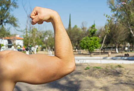 man doing pull ups in park outdoor, exercise,