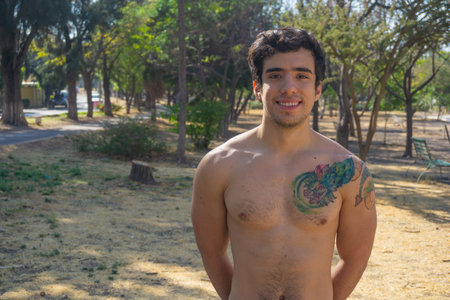 Man doing exercise calisthenics, bent arm straddle planche in parkの写真素材