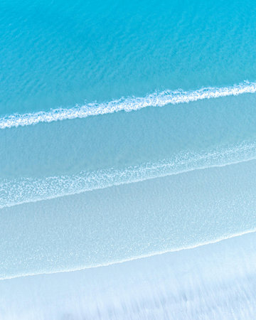 Aerial view of a beautiful beach with turquoise water and white sandの写真素材