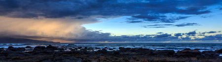 Panoramic view of a stormy sea at sunset in Tenerife