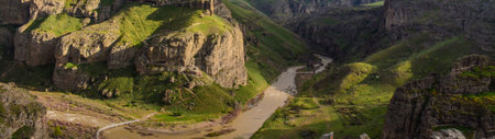 Panoramic view of the river and the cliffs in the mountainsの写真素材