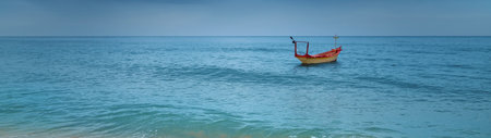 Fishing boat on the beach. Panoramic view of the sea.の写真素材