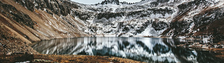 Panoramic view of a lake in the mountains. Beautiful winter landscape.の写真素材