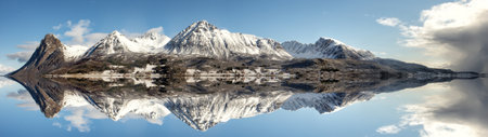 Panoramic view of the mountains reflecting in the water of Lake Wakatipu, Queenstown, New Zealandの写真素材