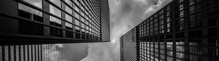 Black and white panoramic view of modern skyscrapers in business districtの写真素材