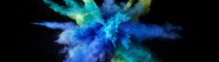 Explosion of colored powder isolated on black background. Abstract colored background